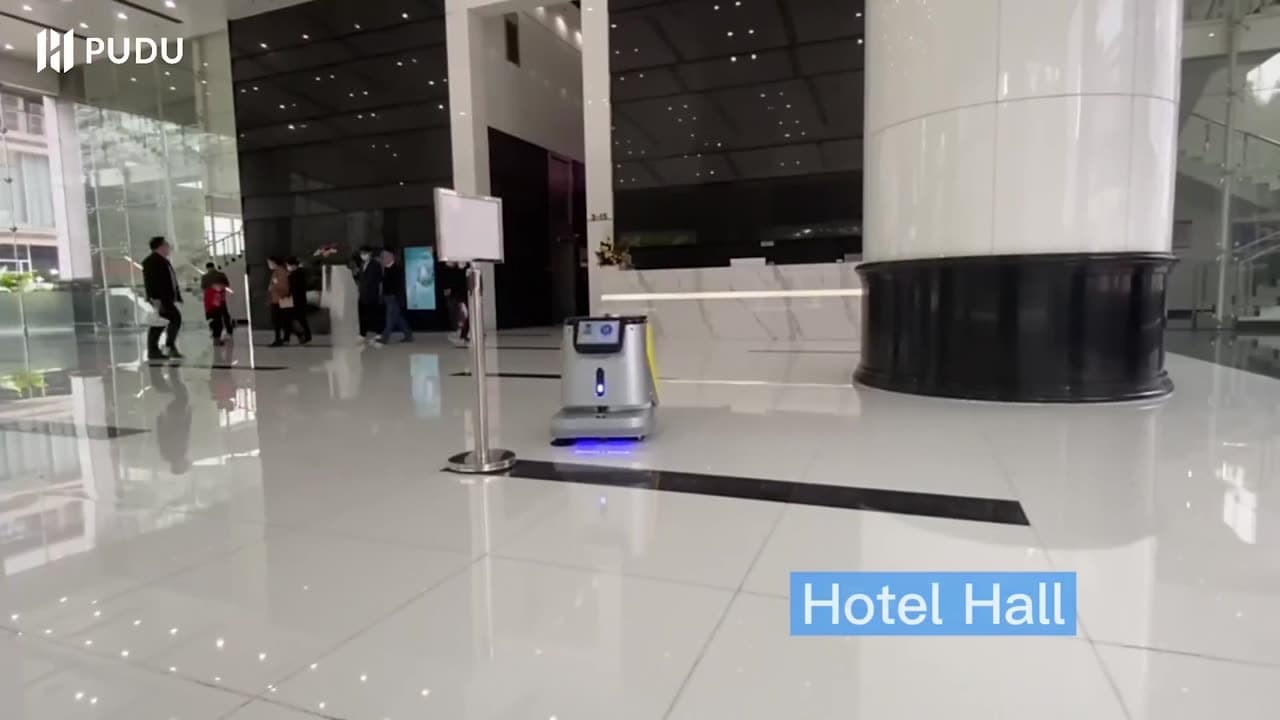 A Pudu CC1 cleaning robot at work in a hotel hall
